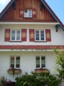 This is the house of nicholas house inscription shingle photo