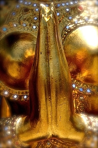 Pray gold sculpture