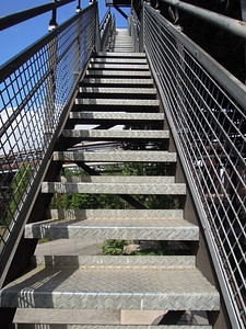 Steep gradually metal stairs photo