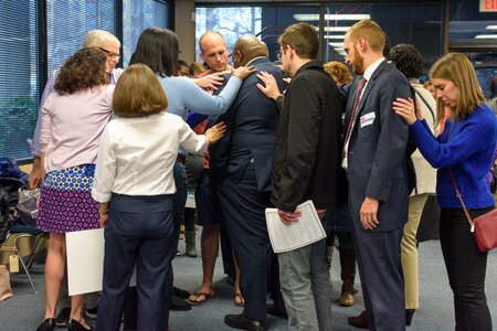 Campaign laying hands