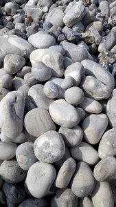 Normandy pebble beach boulders photo