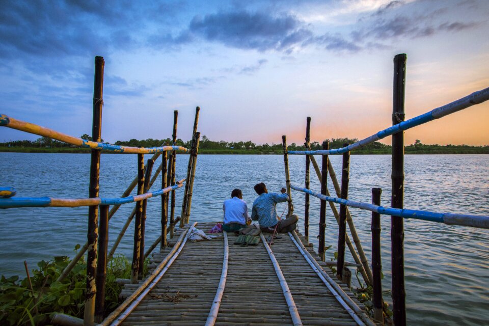 Friendship sunset fisherman
