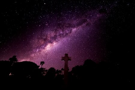 Under the sky night shot black cross photo