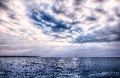 Dramatic sunbeam sea photo