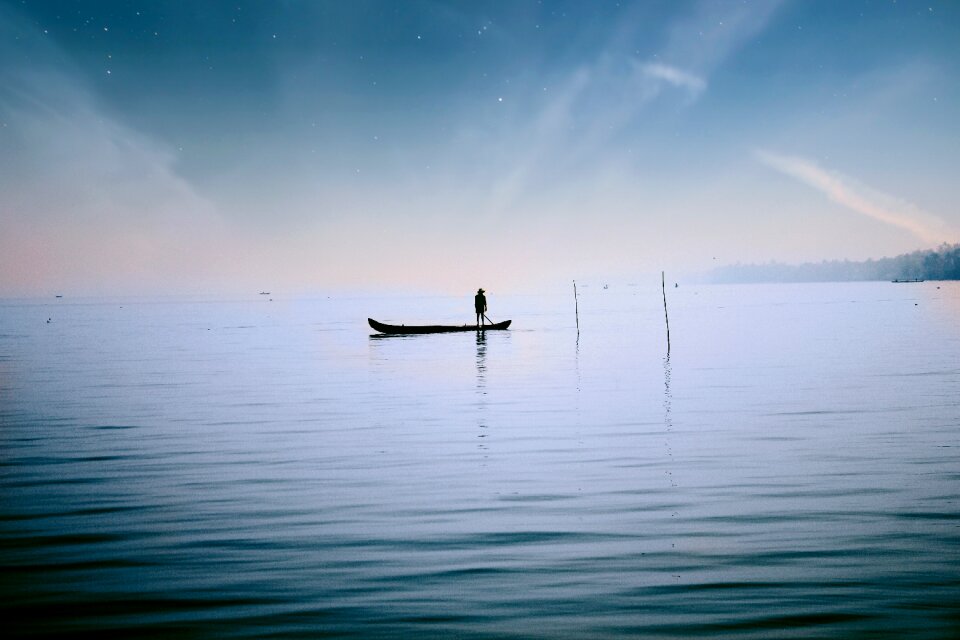 Boat fishing sunset