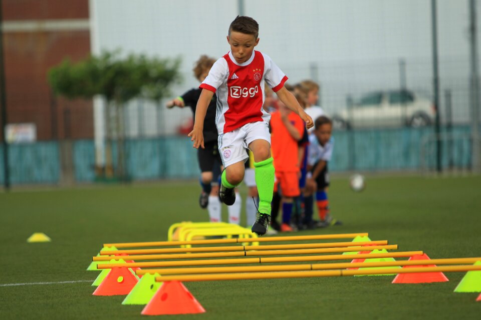 Soccer player training pupils football