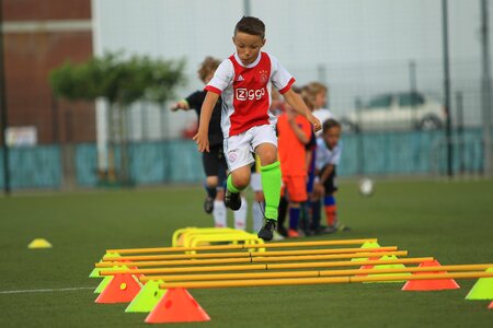Soccer player training pupils football