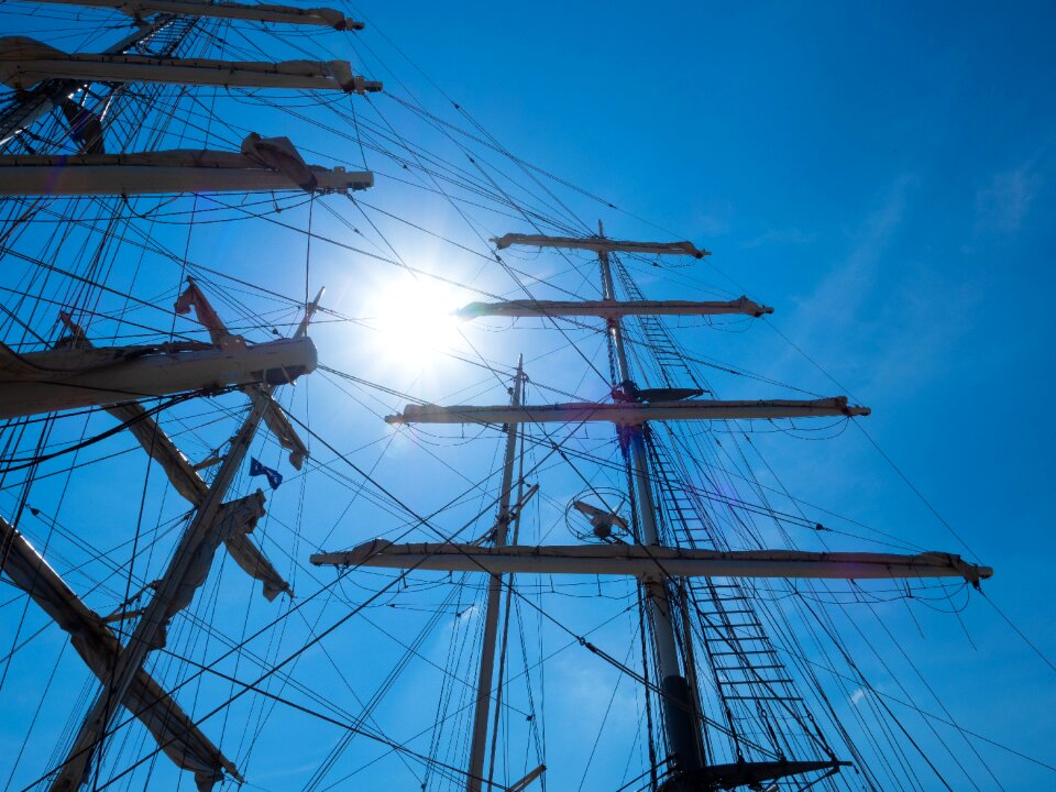 Distant port sailing boat