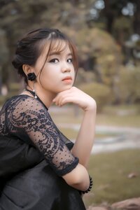Young girl sit look depression from photo