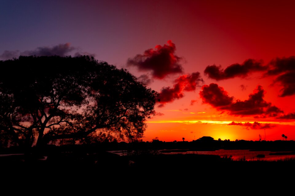 Glowing red clouds dramatic sun photo