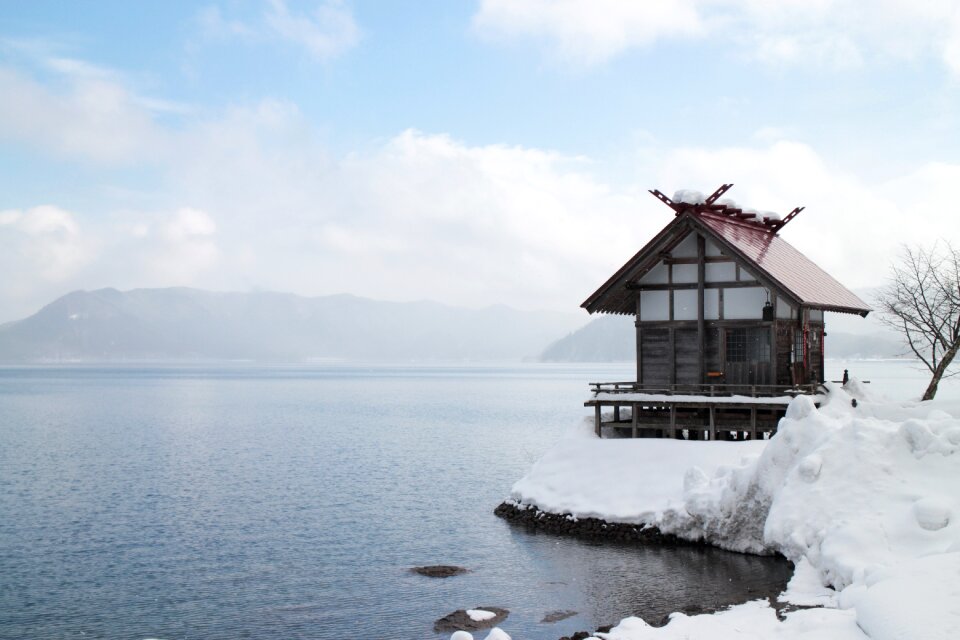 Lake winter snow hut