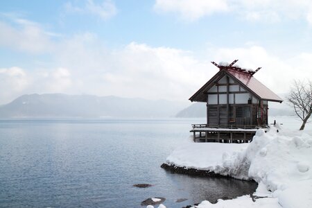 Lake winter snow hut photo