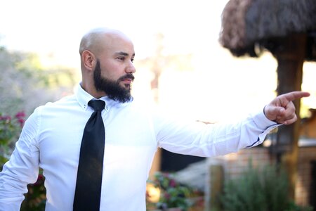 Bald beard pointing photo
