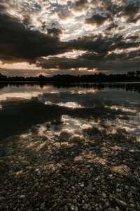 Reflection stones clouds photo