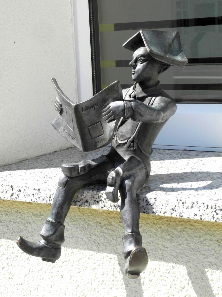 Small sculpture on the window sill calauer schuster young reading
