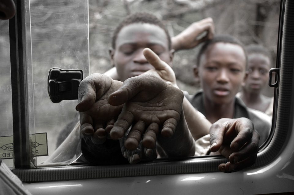 Starving children waiting in addition to the road somewhere in tanzania