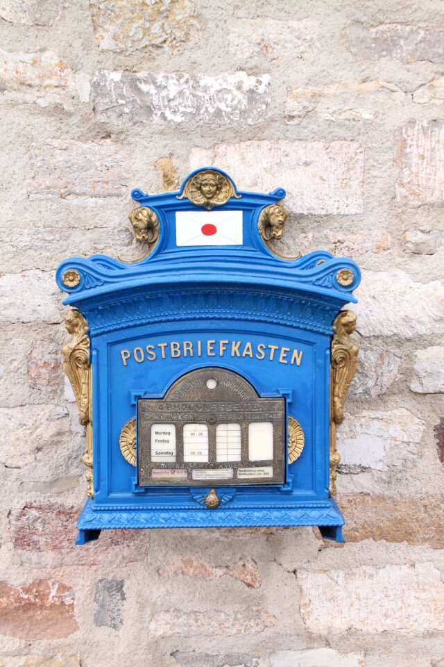 Post mail box throw a blue