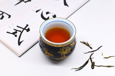 Tea cup copybook pu-erh tea photo