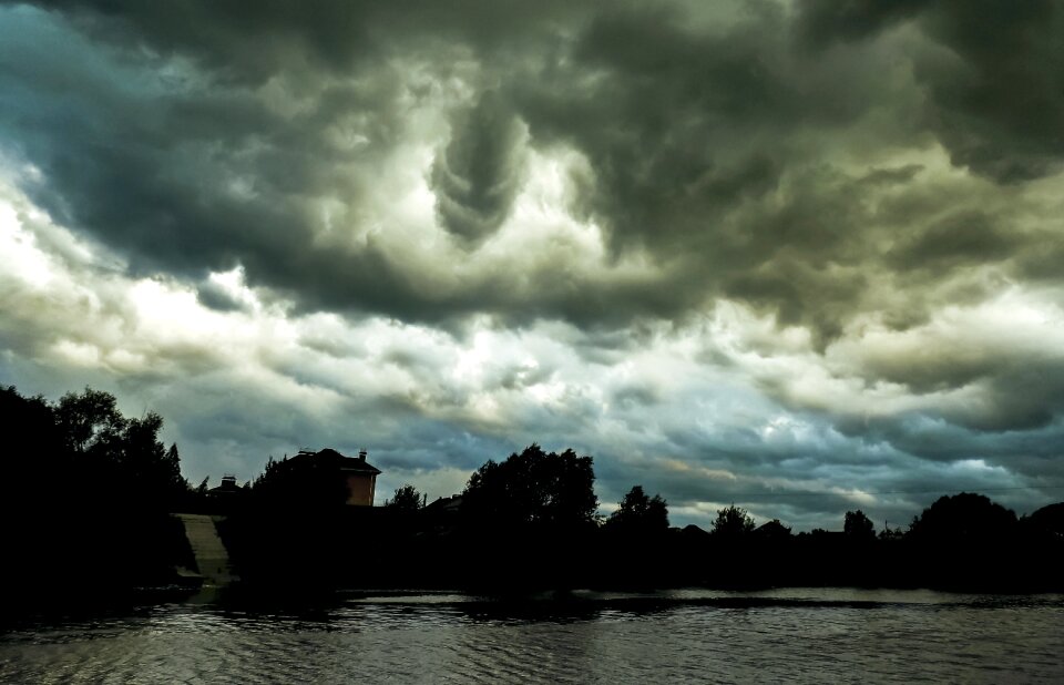 Clouds over the river black clouds the sky in the clouds