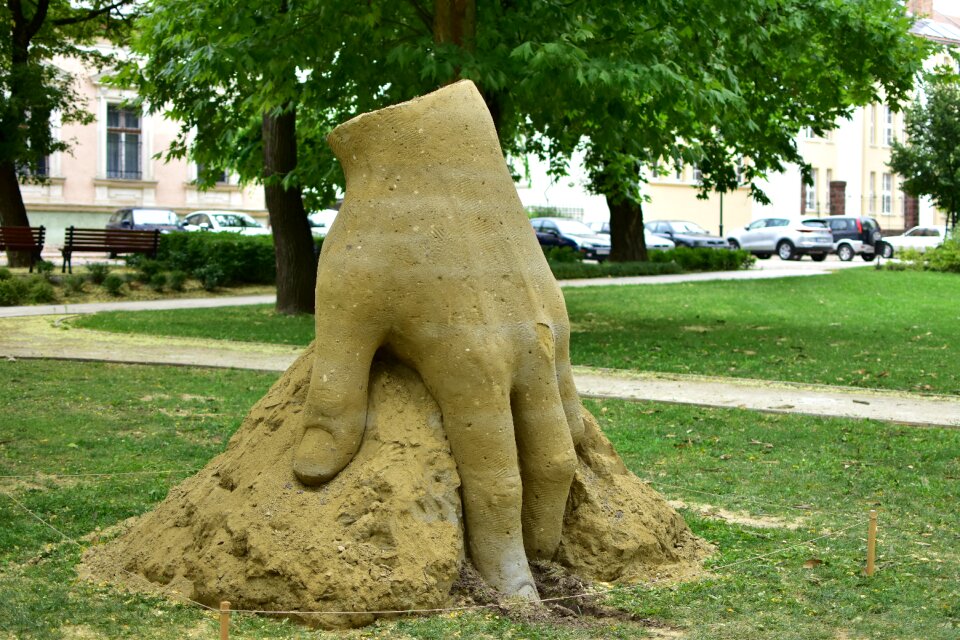 Statue hand sand