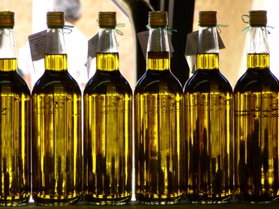 Olive oil market bottles photo