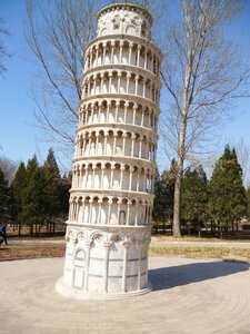 The leaning tower of pisa a smaller version of the blue sky trees