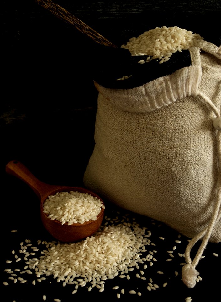 Dark photo rice in a sack brown rice
