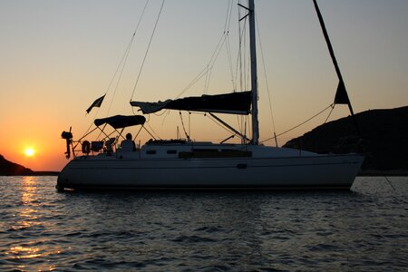 Sailboat sunset anchorage photo