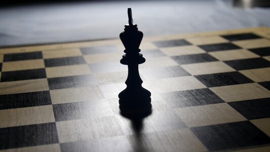 Chess pieces checkmated board game photo