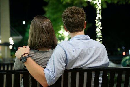 City couple bench photo