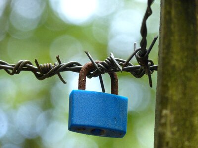 Chained closed barbed wire