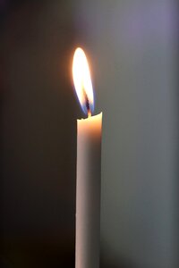 Candlelight light gray candle photo