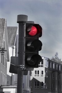 Red traffic lights stop black and white photo