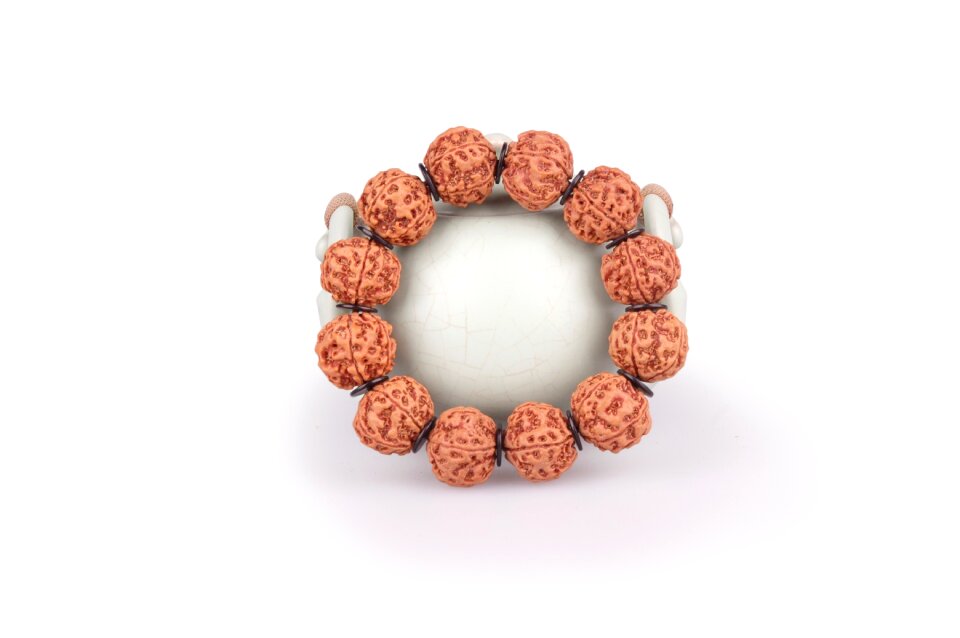 Man playing bracelet horn barrel beads