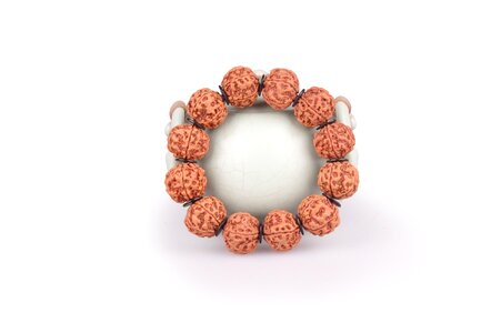 Man playing bracelet horn barrel beads