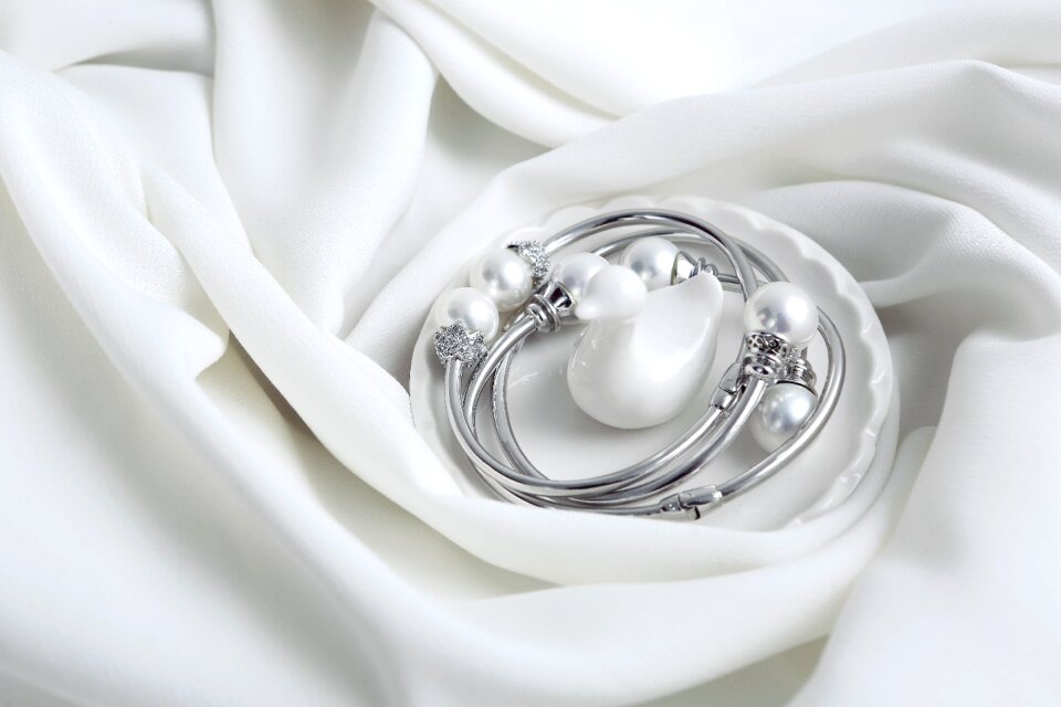Silver and pearl white background jewelry sets