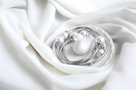 Silver and pearl white background jewelry sets photo