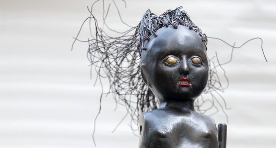 Doll sculpture brass