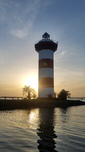 Sunset lighthouse water