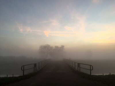 Bridge foggy sunset