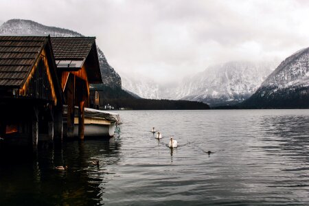 Old Wooden Boathouses in Hallstatt, Austria, on a Foggy Day photo