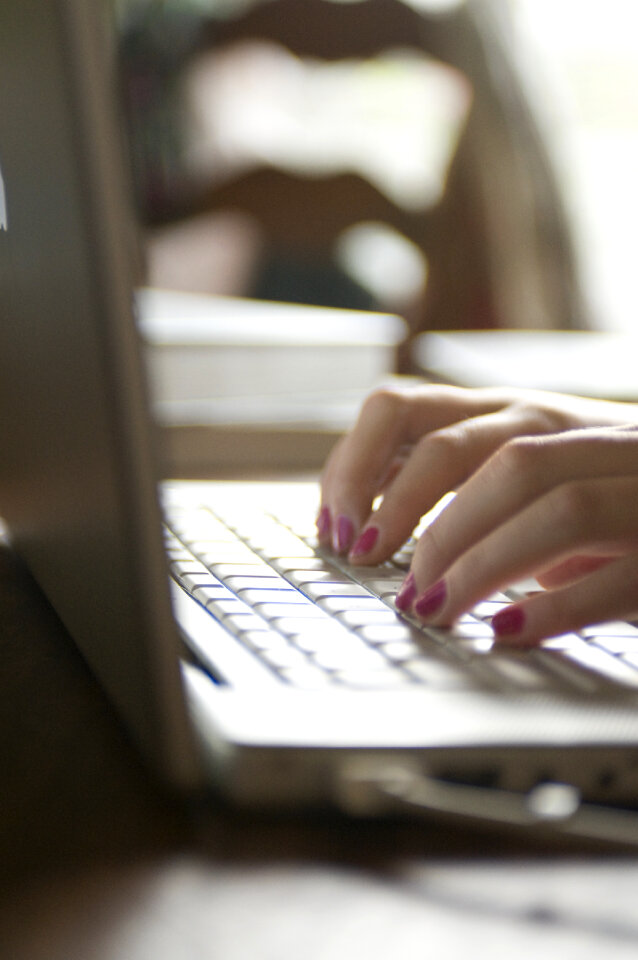 Female Hands Typing On A Laptop Keyboard