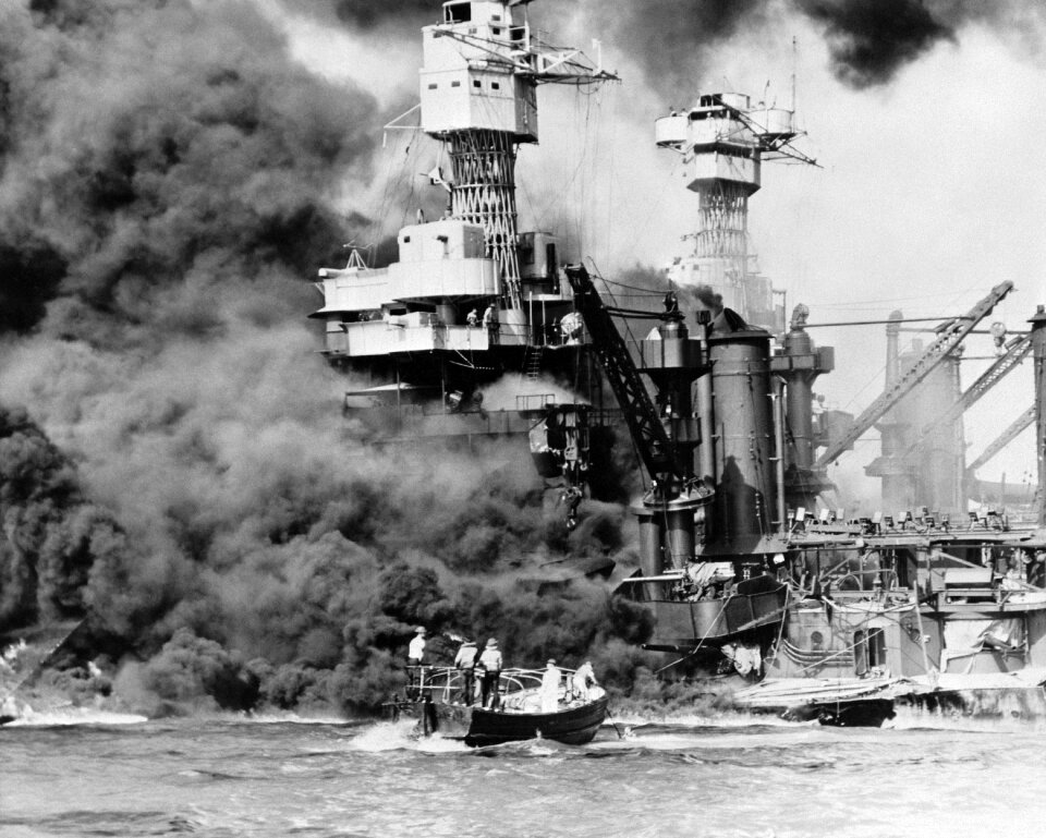 Pearl Harbor, Hawaii. A small boat rescues a seaman