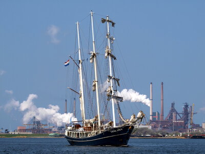 Sailing ship yachts with white sails in the open sea photo