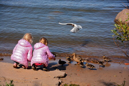 boy and girl in Moyka river, St Petersburg, Russia photo