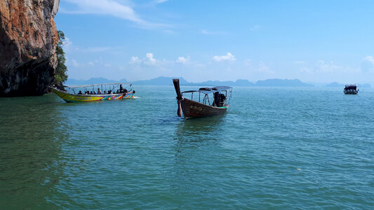 Longtale boat on the white beach at Phuket, Thailand photo
