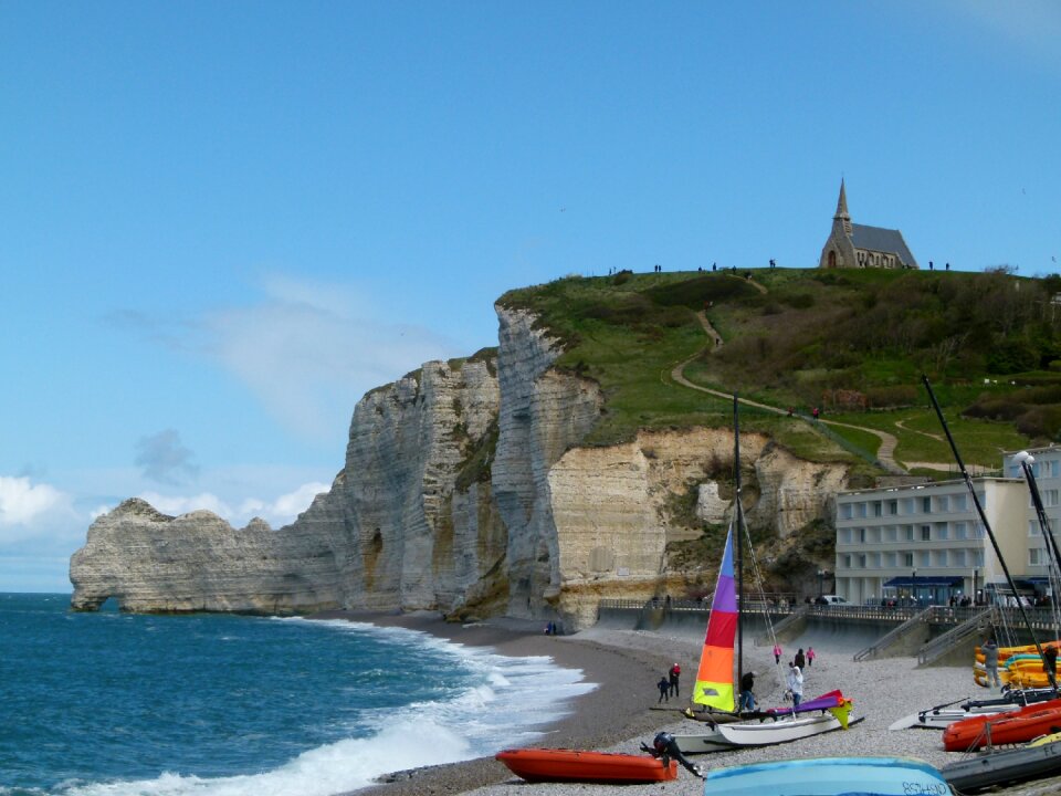Sailboat on the bay beach in Etretat, France