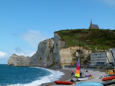 Sailboat on the bay beach in Etretat, France