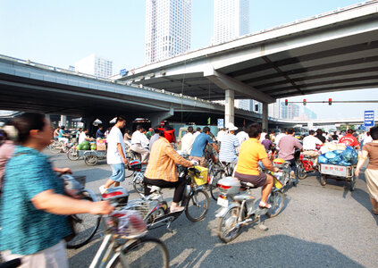 People ride their bicycles on the streets of Beijing, China