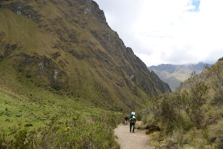 Backpacker walking on Inca Trail to Machu Picchu, Peru photo